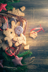 Christmas table broken gingerbread basket full sweets wooden table