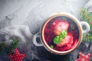 Red borscht dumplings Christmas table place text