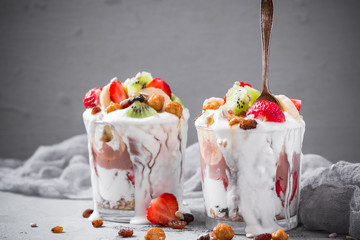 Yoghurt fruit dessert strawberries banana kiwi raisins sunflower seeds oatmeal walnuts caramel