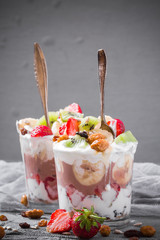 Yoghurt fruit dessert strawberries banana kiwi raisins sunflower seeds oatmeal walnuts caramel