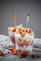 Yoghurt fruit dessert strawberries banana kiwi raisins sunflower seeds oatmeal walnuts caramel