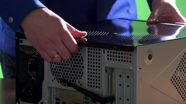 technician hands open desktop pc case cover. Computer repair concept