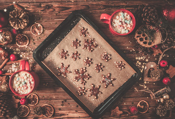 Christmas background and cup with marshmellow on wooden table