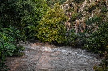 bridge over a stormy river