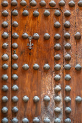 old wooden door decorated with shells