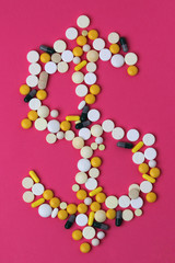 Medicine forming a sign of dollar as a concept of high cost of healthcare