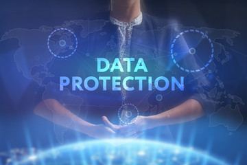 The concept of business, technology, the Internet and the network. A young entrepreneur working on a virtual screen of the future and sees the inscription: Data protection