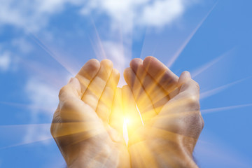 Two open empty hands of man with sky background