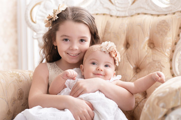 Portrait of happy cute baby girls posing