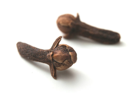 closeup of cloves on white background