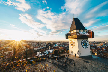 Graz clock tower and city symbol on top of Schlossberg hill at sunset