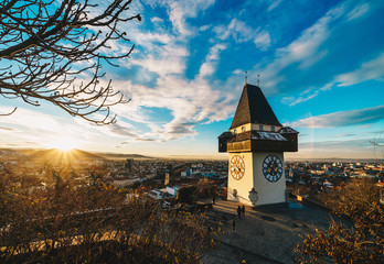 Graz clock tower and city symbol on top of Schlossberg hill at sunset