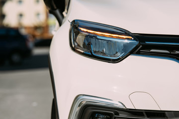close up view of white car on street © LIGHTFIELD STUDIOS