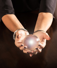Fortune teller holding a crystal ball in her hands