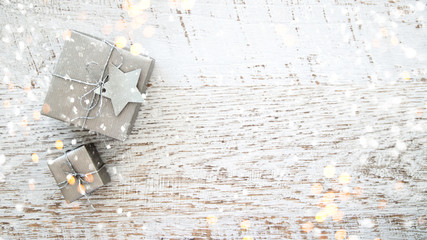 Christmas and New Year holiday background. Xmas greeting card. Christmas gifts on white wooden background top view. Flat lay