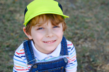 Adorable active little kid boy having fun on Miami beach, Key Biscayne. Happy cute child relaxing, playing and enjoying sunny warm day. Portrait of beautiful healthy smiling boy