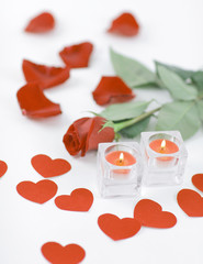 Fototapeta na wymiar romantic concept .burning candle and red rose . photo with copy 
