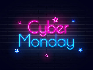Neon text Cyber Monday on brick wall background with stars for advertisement concept.