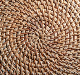 Handmade Wicker Rattan woven surface a circular pattern Background.