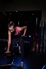 Fototapeta na wymiar Beautiful women working out in gym