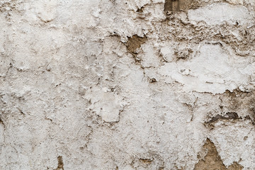 white paintet wall of a building, severely weathered, texture