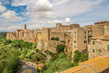 Fototapeta na wymiar View at the old stone buildings in Pitigliano town - Italy
