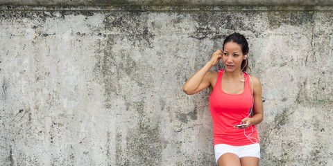 Sporty woman using smartphone