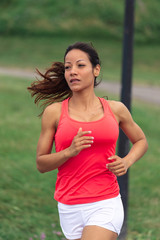 Fit woman running at the park
