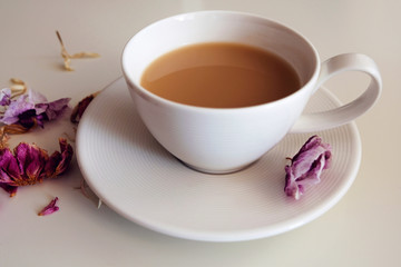 a white cup with coffee