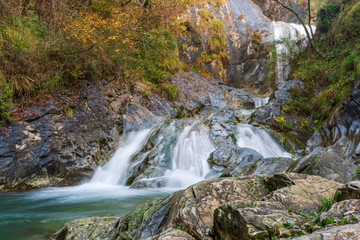 Waterfall and autumn colors. Magic of the Julian pre-Alps.