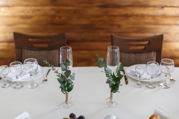 two decorated glasses.
dishes on the festive table.
festive table in the restaurant.
