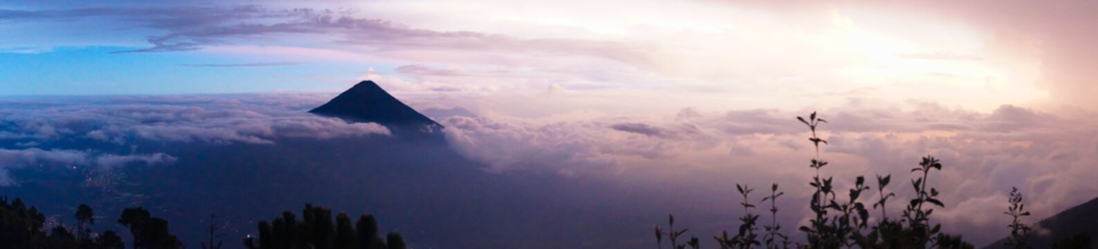 Beautiful and colorful night landscape at the top of volcano acatenango with view on volcano Agua. Panorama photo.