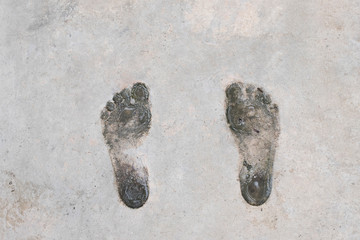 Footprint human on cement. Background and texture of footprint. Wet and dirty of footprint human on cement.