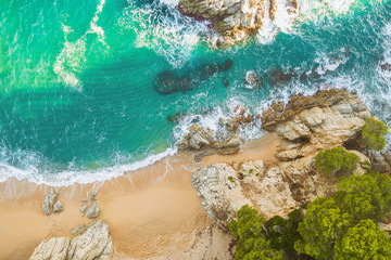 Beach full of rocks and waves in Spain