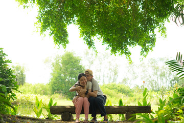 Fototapeta premium Couple hugging among nature in the garden. Happiness time for couple.