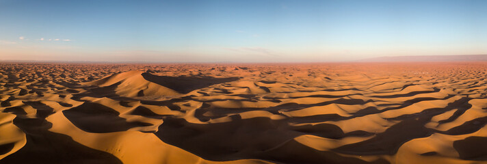 Aerial panorama in Sahara desert at sunrise