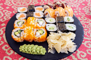 sushi on a black plate