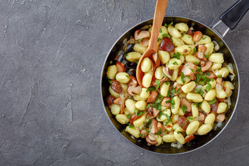 Potato gnocchi with porcini on a skillet