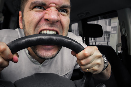 Emotional person. The driver of the car screams at someone in traffic jam. Concept hysterics and broken car