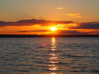 Fototapeta premium Sunset. On the big river. Coast. Beautiful clouds. Summer. Russia, Ural, Perm region
