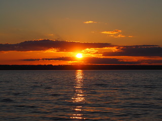 Sunset. On the big river. Coast. Beautiful clouds. Summer. Russia, Ural, Perm region