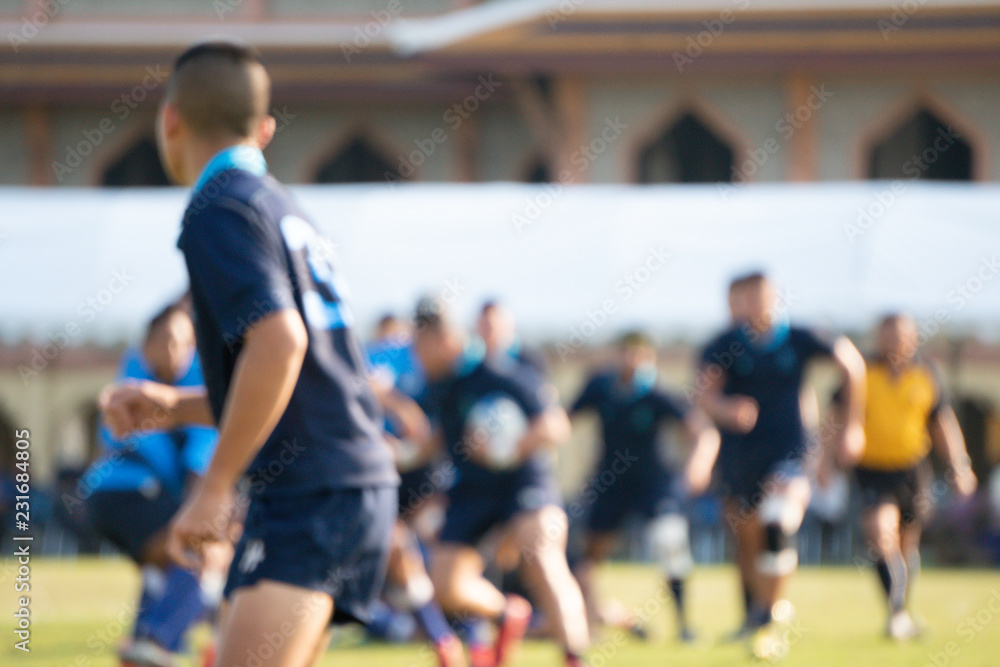 Wall mural Blurred background image of school rugby game