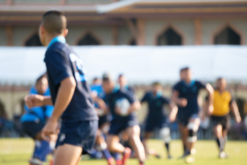 Blurred background image of school rugby game