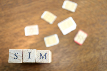 Wooden Text Block of SIM and SIM cards