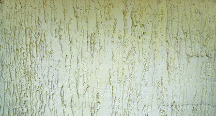 Abstract textured background: mixture of blue and green putty. Uneven strokes, rough texture of a wall pattern