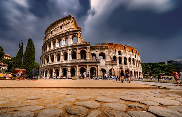 Obraz na płótnie Canvas Tourists Visiting The Colosseum in Rome Italy