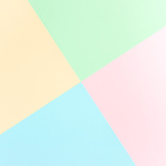 Background pastel colors: pink, yellow, blue, green. Geometric pattern papers. Minimal concept. Flat lay, Top view. 