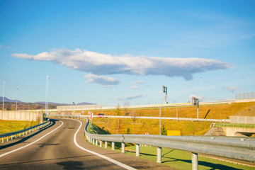 Landscape view on Expressway with  mountains  and  blue sky background.