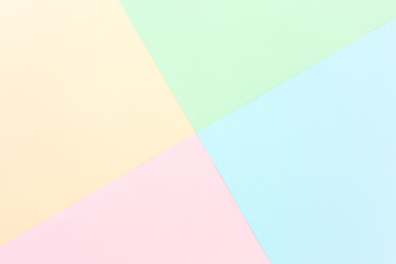 Background pastel colors: pink, yellow, blue, green. Geometric pattern papers. Minimal concept. Flat lay, Top view. 