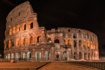 Fototapeta na wymiar Coliseum in Rome by Night - Colosseum is one of the main travel attractions - The Main symbol of Rome